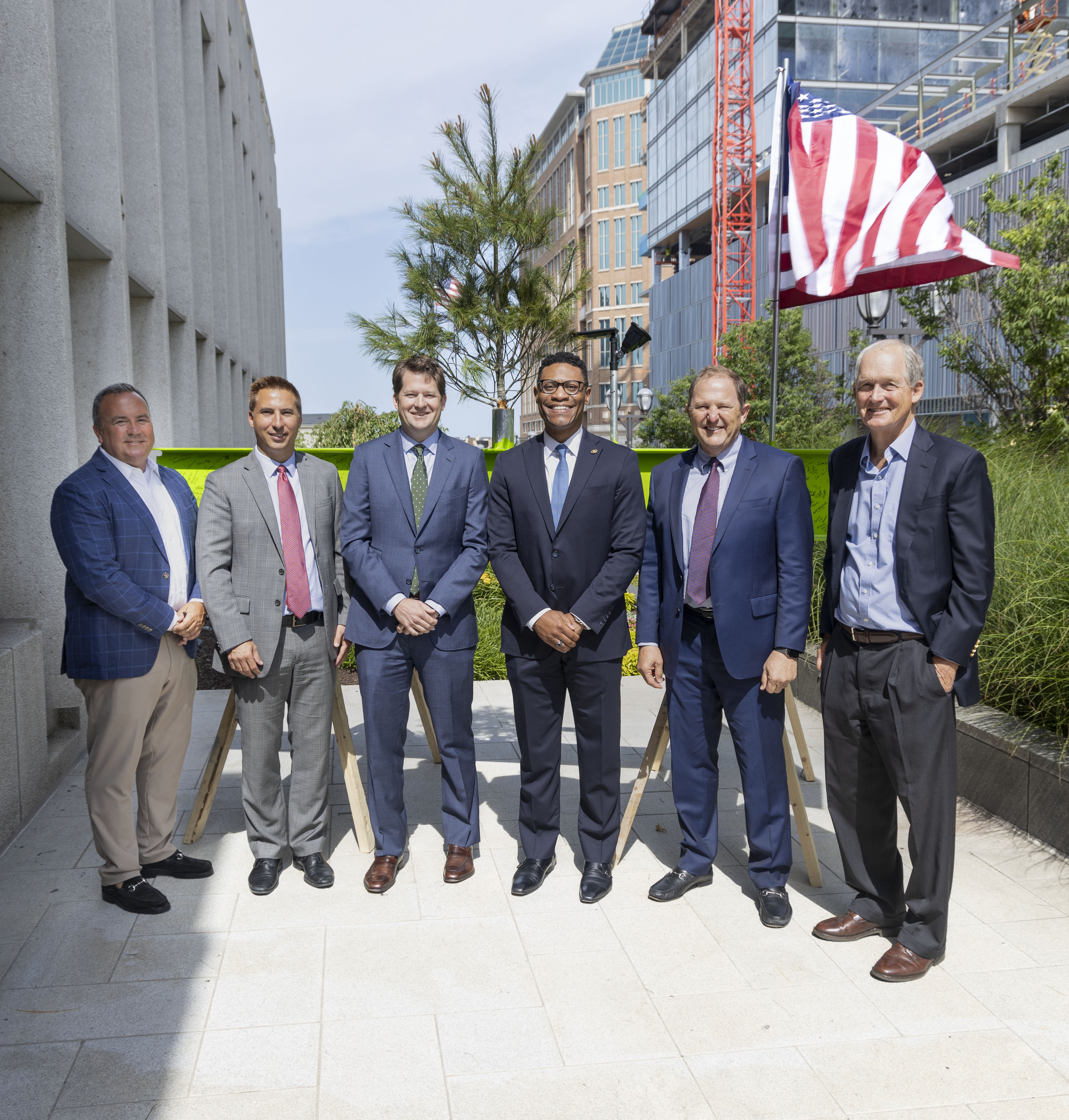 Group of people in front of a Commerce Bank Building.